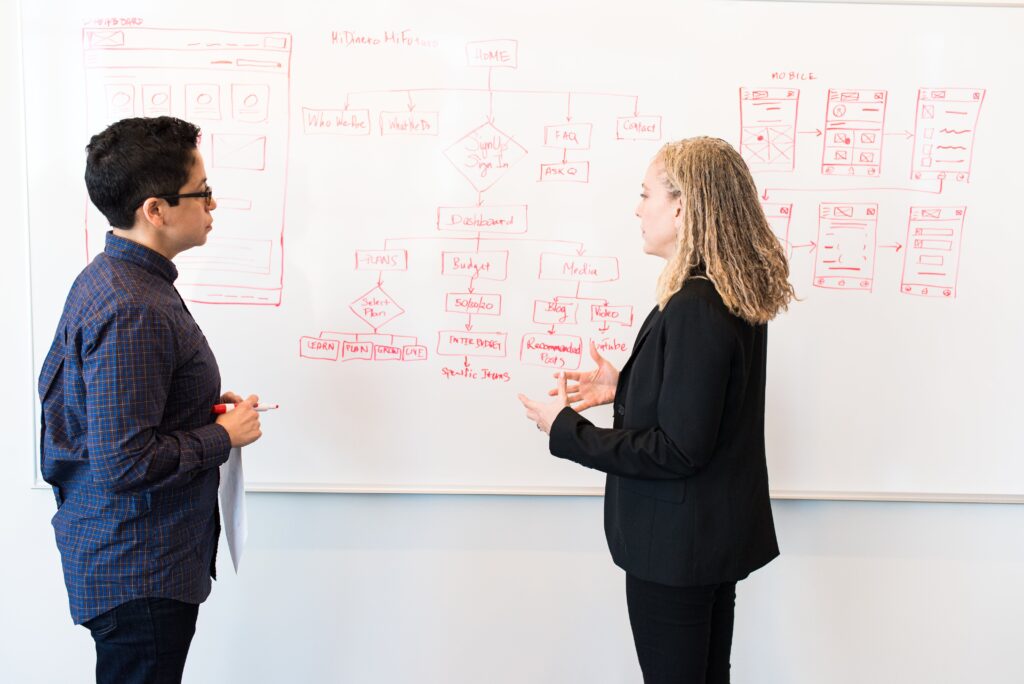 Two businesspeople discussing strategy.